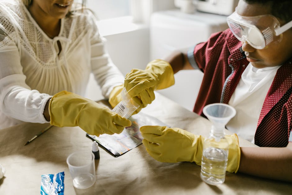 Young child performing a simple at-home science activity with adult supervision.